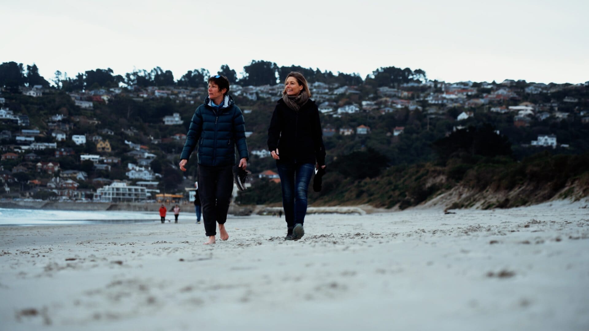 Film characters walking along beach